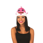 Op deze afbeelding zie je een Accessoires, van het merk Rubies. Roze Mommy Shark Muts Met Geluid