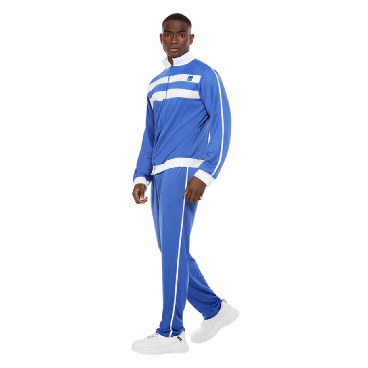 Op deze afbeelding zie je een Kostuums, van het merk Smiffy's. Tokkie Trainingspak Nelis Man Kostuum